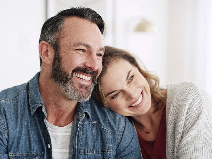 Husband and wife smiling
