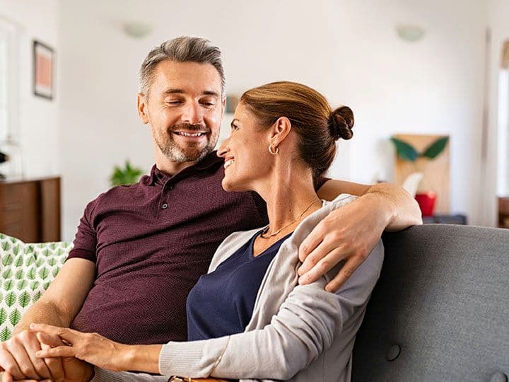 Husband and wife smiling