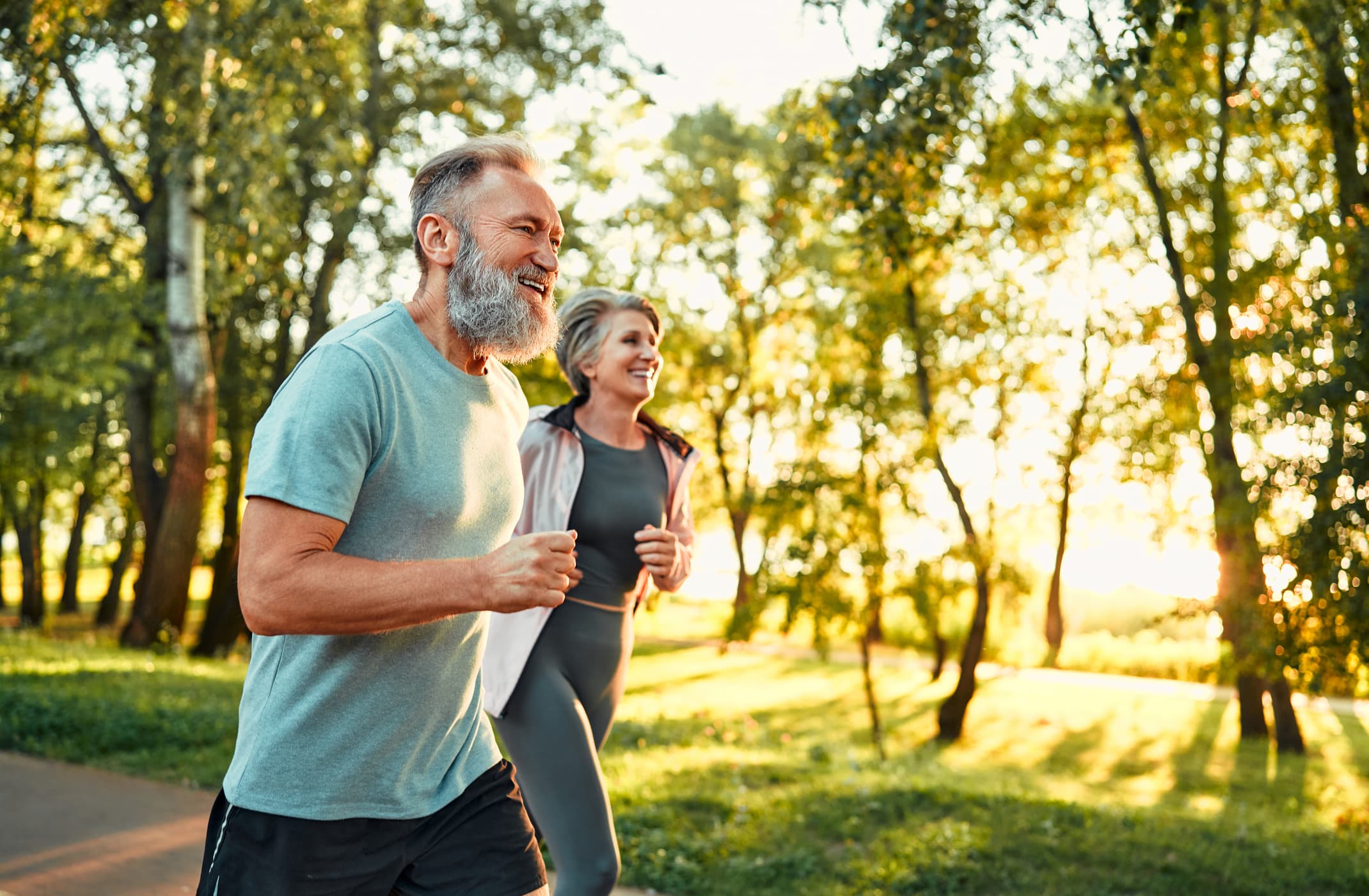 Couple running outdoors representing health and wellness
