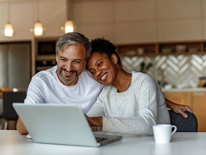 Husband and wife smiling