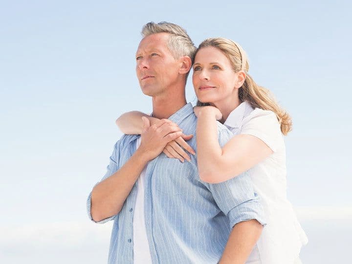 Husband and wife smiling