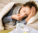 Sick woman sneezing
